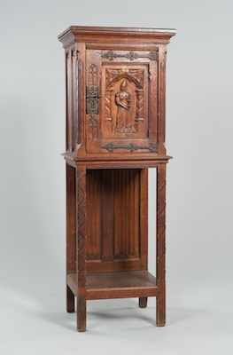 Appraisal: A Belgian Gothic Style Carved Wood Cabinet with Hand Wrought