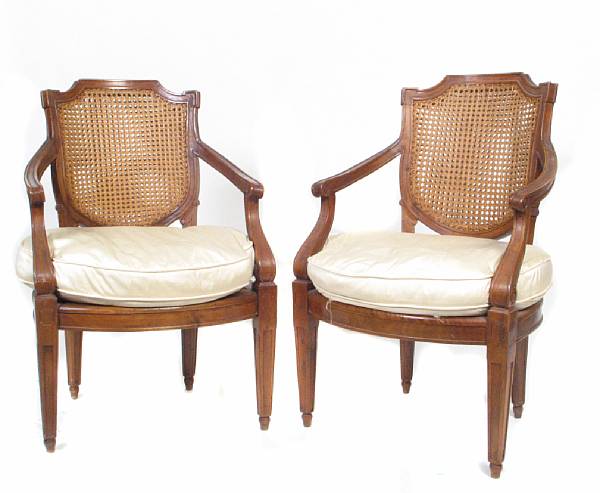 Appraisal: A pair of Italian Neoclassical style walnut armchairs height in