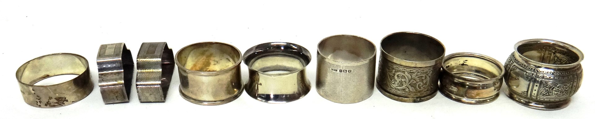 Appraisal: A pair of silver napkin rings with engine turned decoration