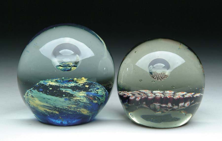 Appraisal: TWO GLASS PAPERWEIGHTS Lot consists of a red white and