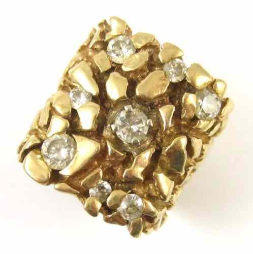 Appraisal: DIAMOND AND FOURTEEN KARAT GOLD RING The heavy gold nugget