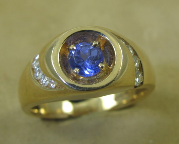 Appraisal: MAN'S TANZANITE DIAMOND AND FOURTEEN KARAT GOLD RING centering a