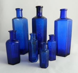 Appraisal: Poison cobalt hexagonal bottles Poison- cobalt hexagonal- are embossed on