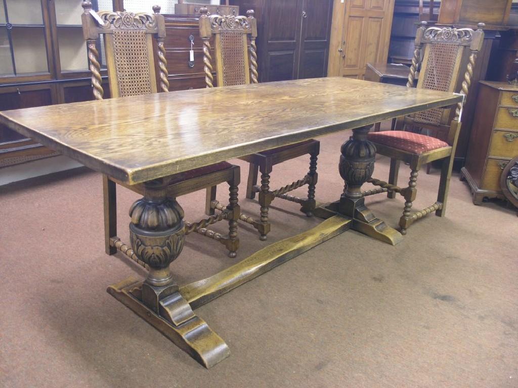 Appraisal: A solid dark oak refectory table on carved bulbous end