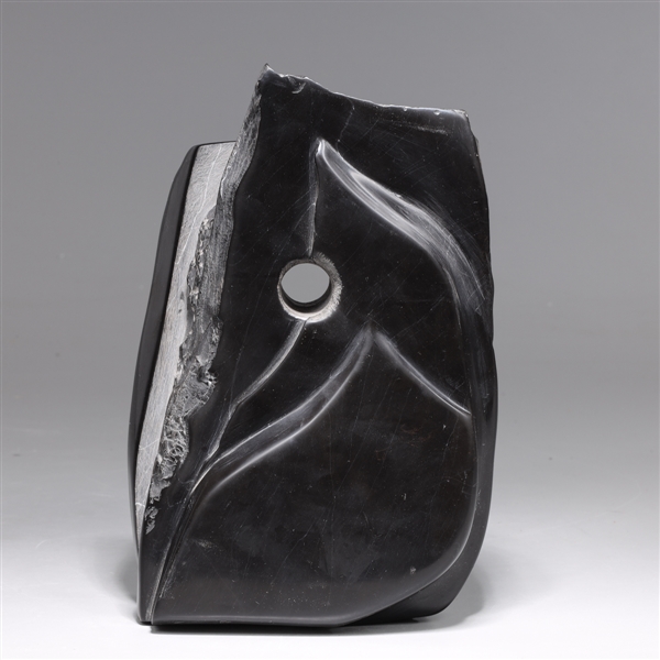 Appraisal: Warren Arnold abstract th century black stone sculpture black polish