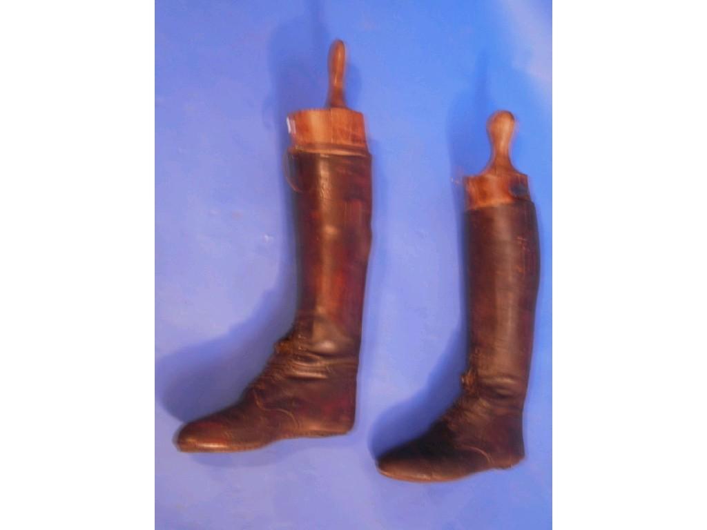 Appraisal: A pair of leather riding boots and trees