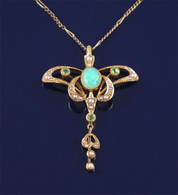 Appraisal: An Art Nouveau seed pearl opal and demantoid garnet gold