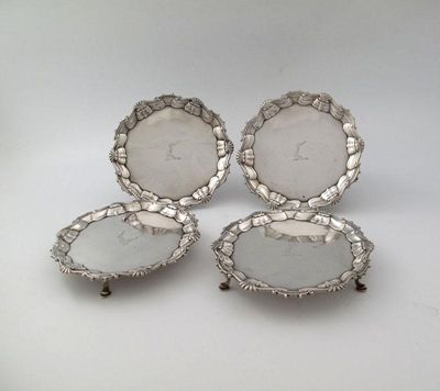 Appraisal: A set of four George II silver waiters by James