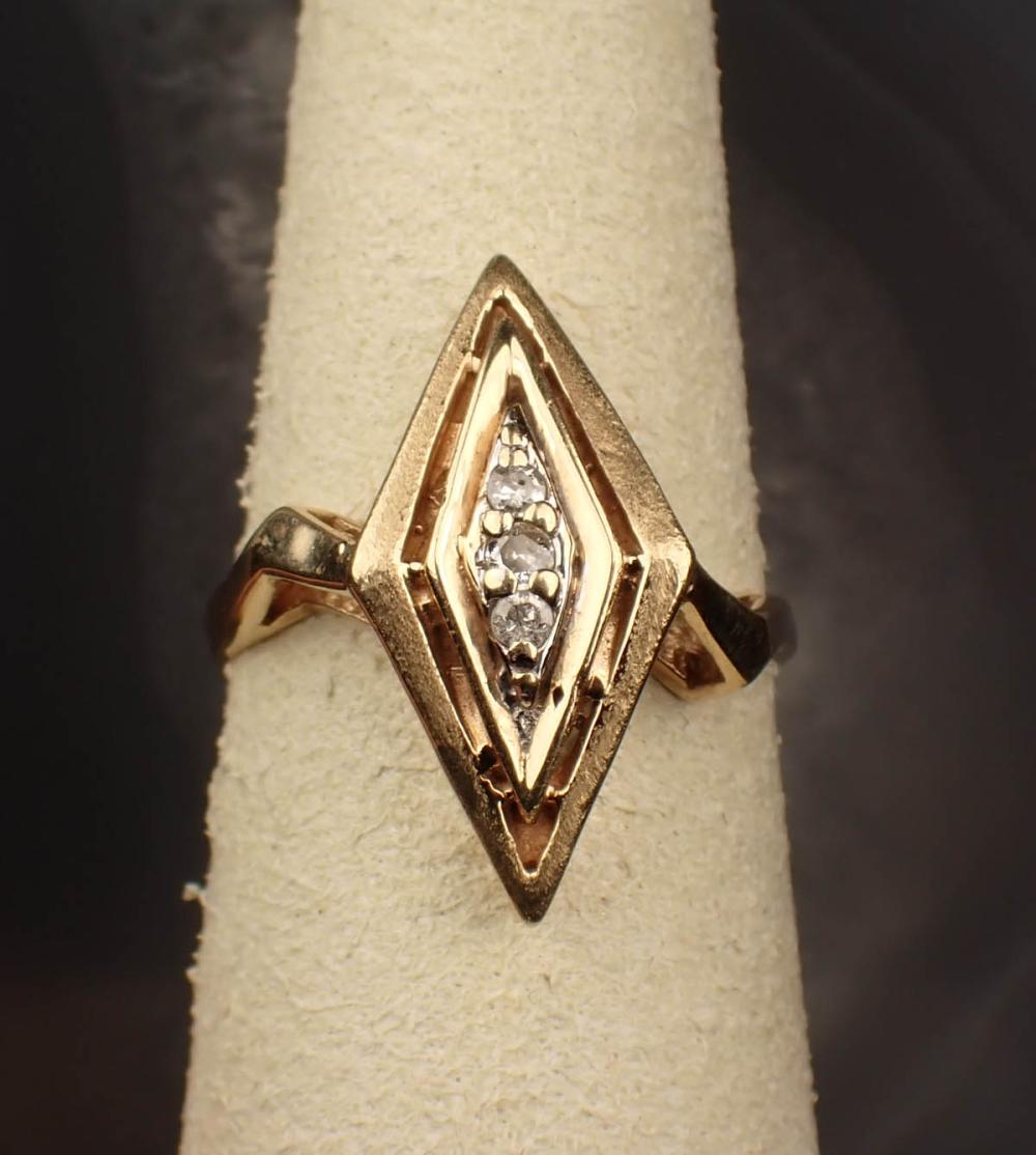 Appraisal: DIAMOND AND FOURTEEN KARAT YELLOW GOLD RING The navette style