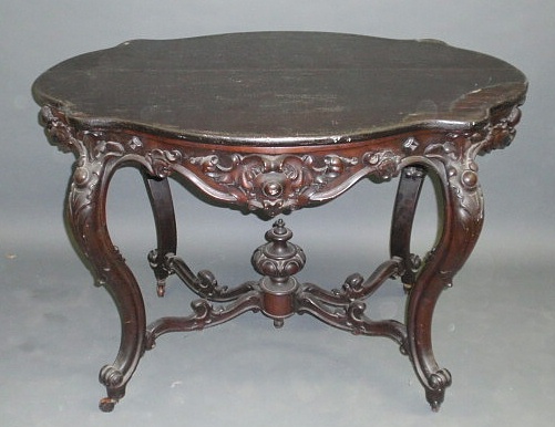 Appraisal: Victorian carved walnut occasional table with a turtle top h