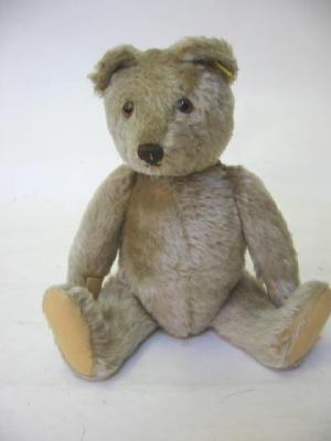 Appraisal: A mid th century Steiff teddy bear covered in beige