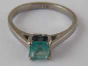 Appraisal: A platinum and emerald ring the emerald measuring approx x