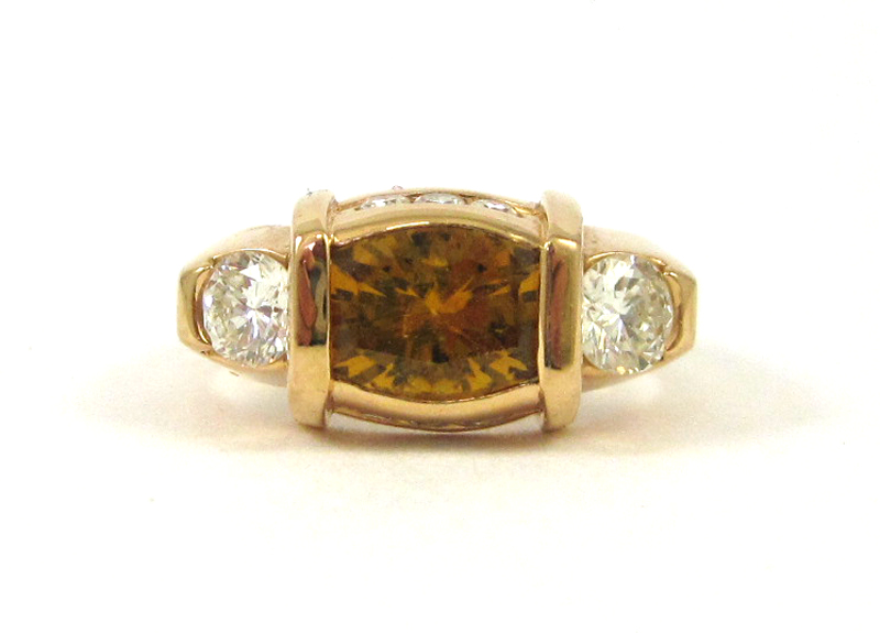 Appraisal: GOLDEN TOPAZ AND DIAMOND RING k rose gold with eight