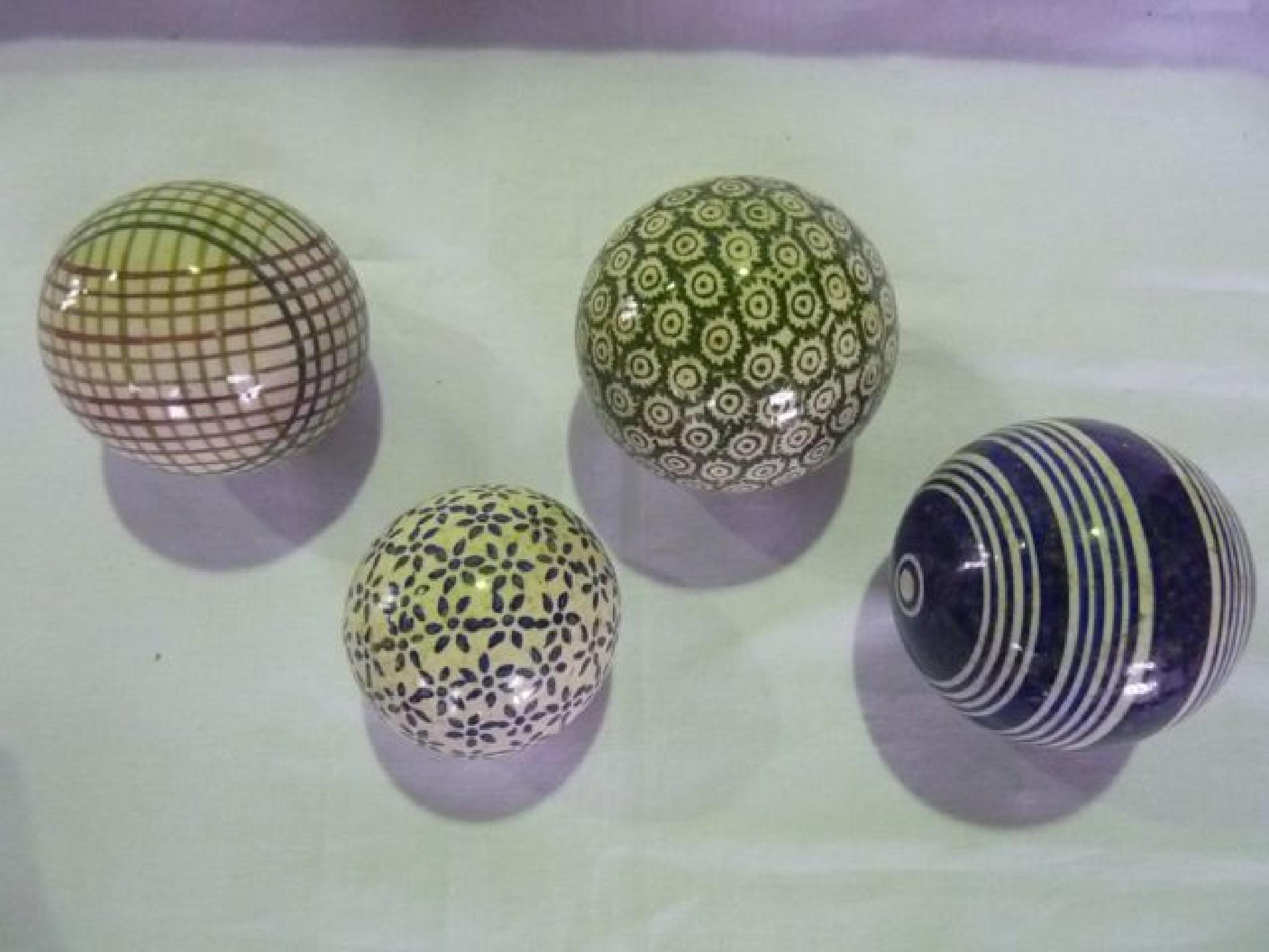 Appraisal: Four carpet bowls with hand painted detail