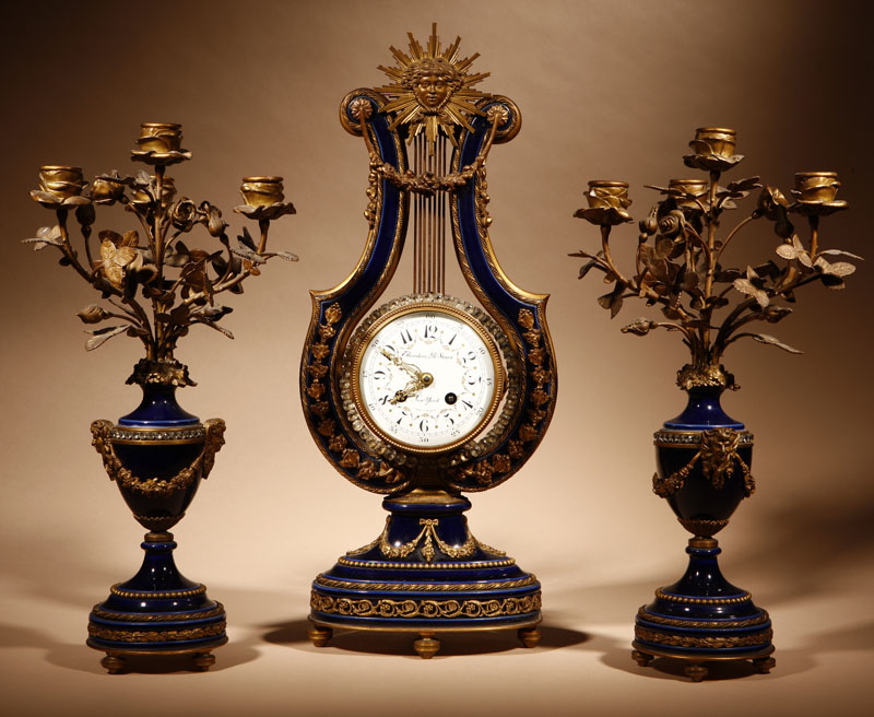 Appraisal: A Louis XVI style gilt bronze-mounted cobalt blue porcelain three-piece