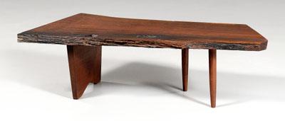 Appraisal: Nakashima free-form coffee table figured single-board walnut top two turned