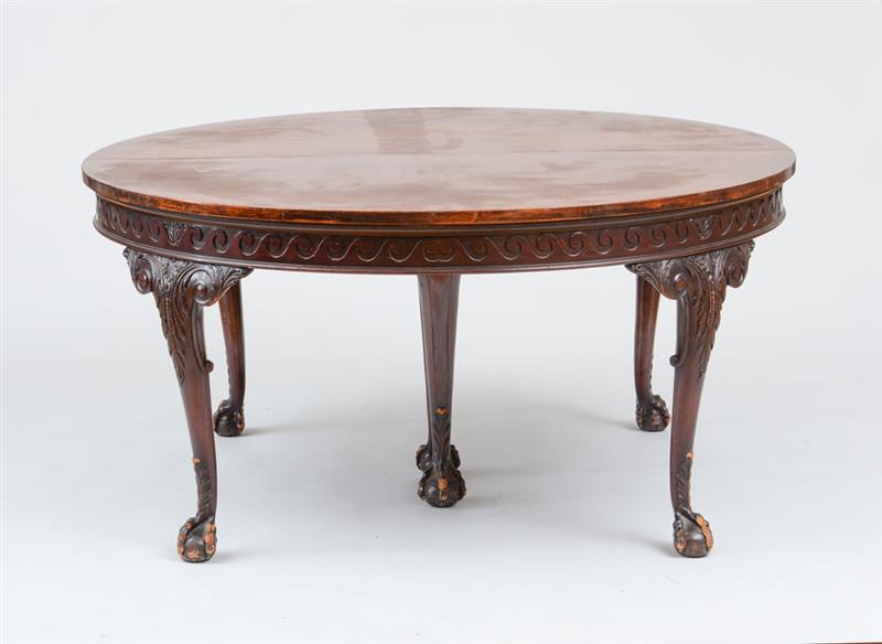 Appraisal: GEORGE III STYLE CARVED MAHOGANY EXTENSION DINING TABLE The circular