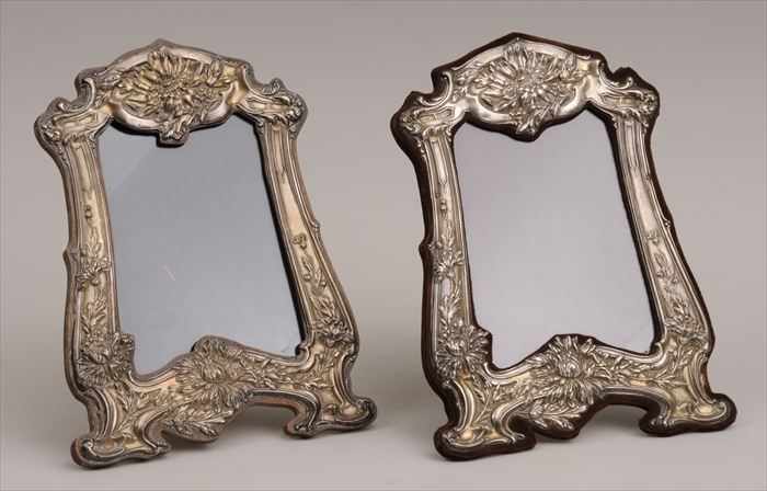 Appraisal: ASSEMBLED PAIR OF ENGLISH ART NOUVEAU SILVER PICTURE FRAMES Marked