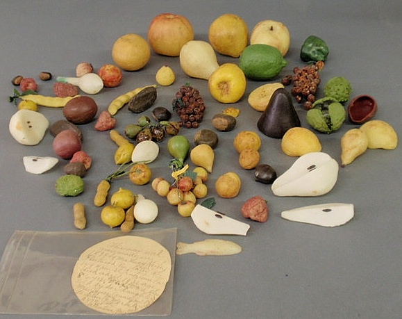 Appraisal: Group of th c wax fruit nuts etc with note