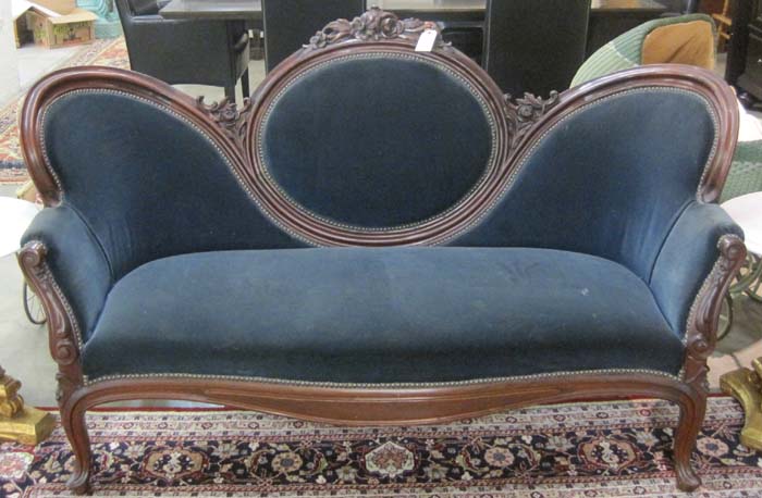 Appraisal: VICTORIAN STYLE MEDALLION-BACK SOFA American early th century having a