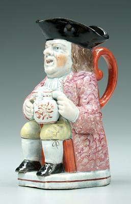 Appraisal: th century Toby jug seated man in fancy red coat