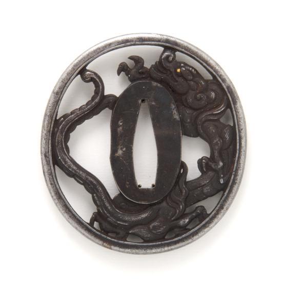 Appraisal: An Iron Tsuba th- th cenutyr Ichiryu Tomoyoshi Mito School