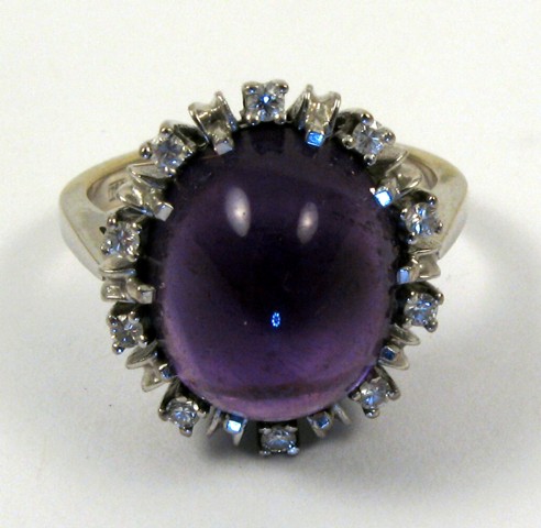 Appraisal: AMETHYST AND DIAMOND RING k white gold and centering an