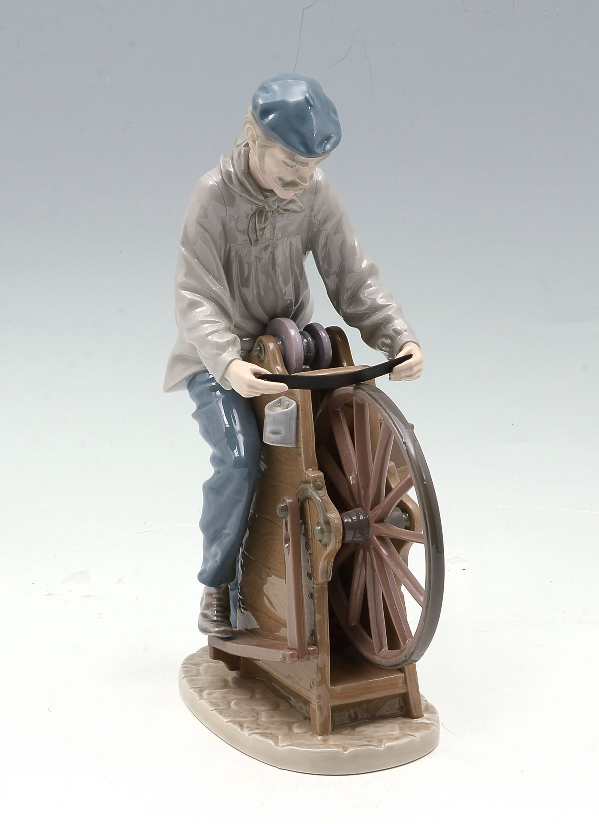 Appraisal: LLADRO FIGURINE ''SHARPENING THE CUTLERY'' Designed by Salvador Furio -