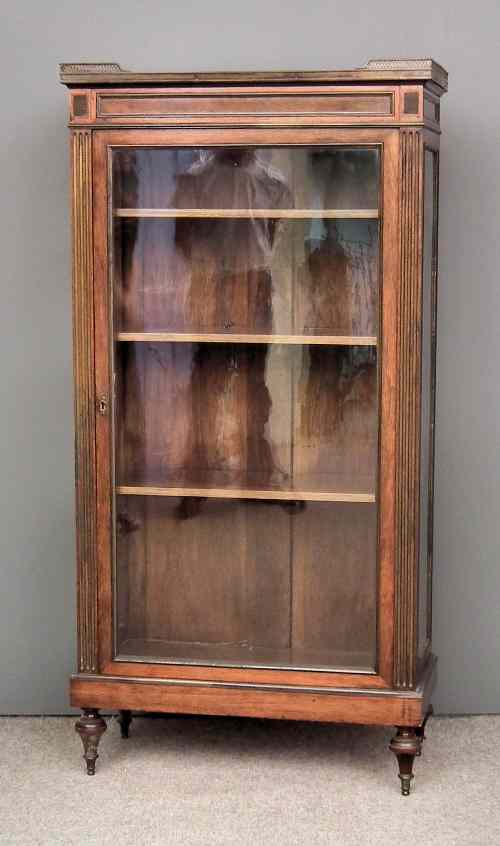 Appraisal: A th Century French rosewood and brass mounted display cabinet