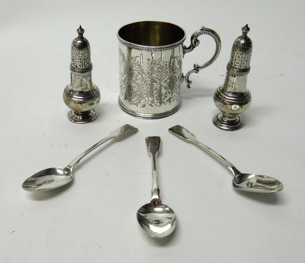 Appraisal: Silver comprising a Victorian christening mug with engraved decoration within