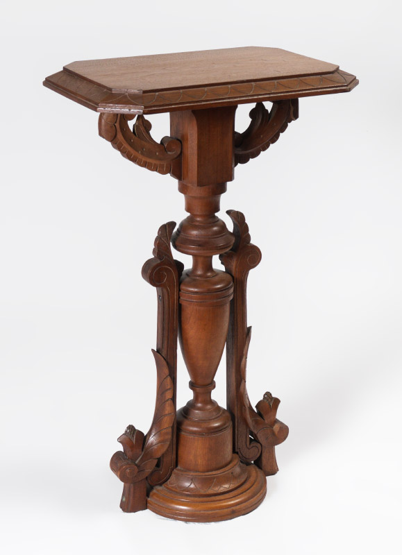 Appraisal: VICTORIAN CARVED WALNUT PEDESTAL Rectangular top with canted corner scroll