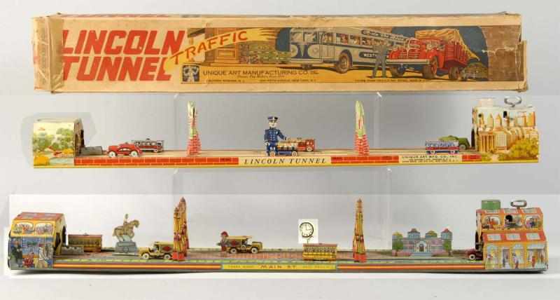 Appraisal: Lot of Tin Litho Traffic Toys Description American Working but