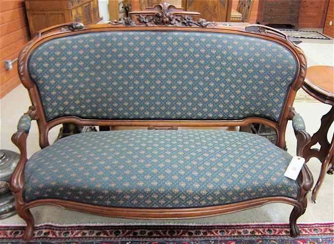 Appraisal: VICTORIAN CARVED AND UPHOLSTERED WALNUT SETTEE Louis XV substyle American