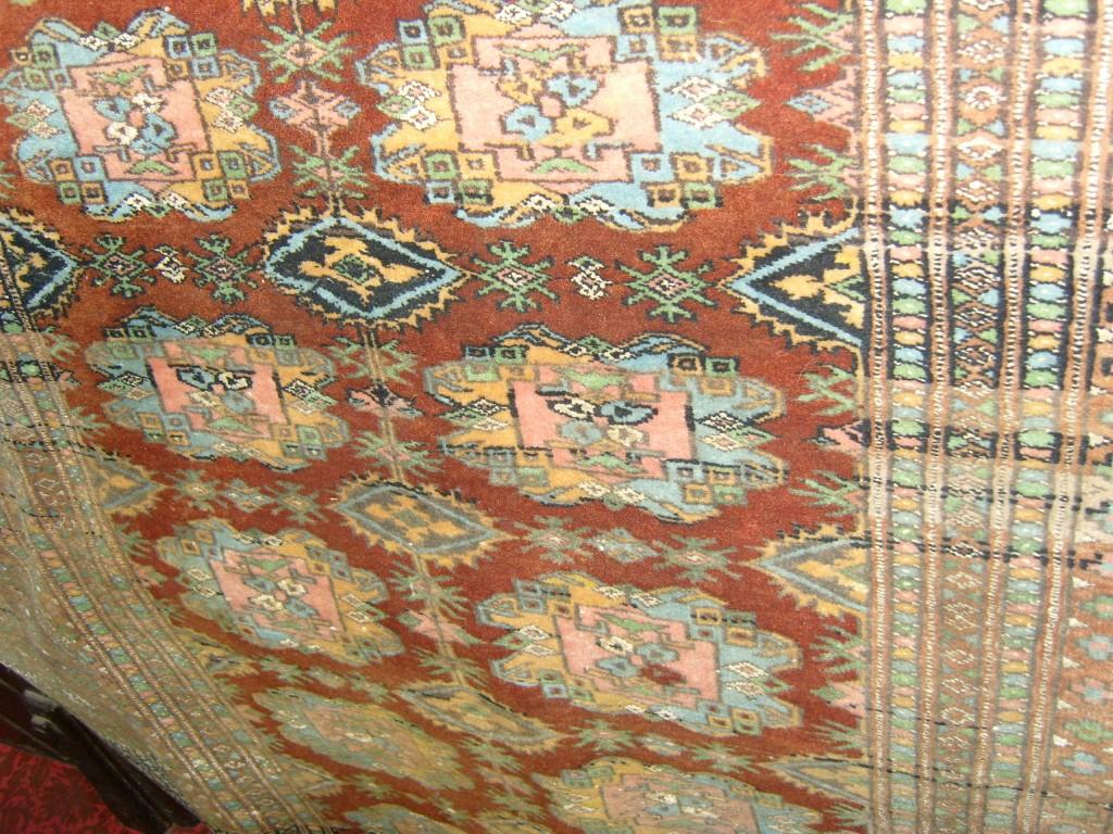 Appraisal: An eastern wool rug with brown ground central field with