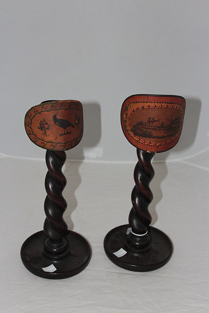 Appraisal: A PAIR OF TURNED OAK CANDLESTICKS with barley twist stems