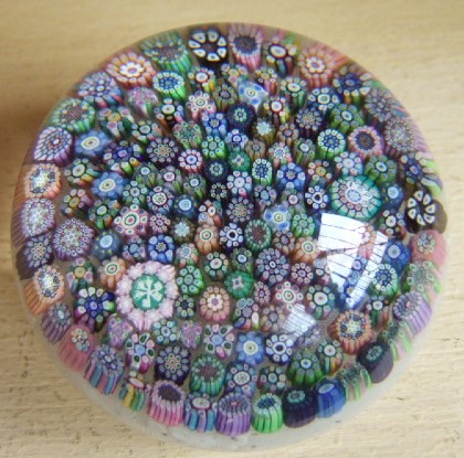 Appraisal: A Baccarat style concentric Millefiore paperweight with date cane for