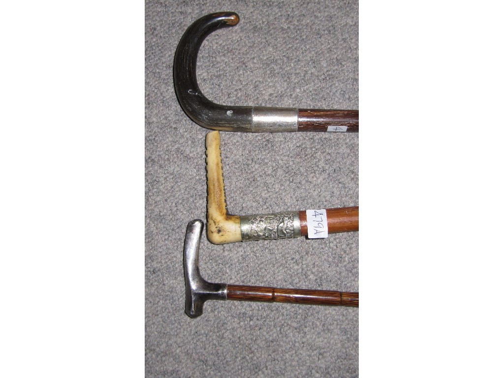 Appraisal: Lot comprising three walking sticks - two silver mounted