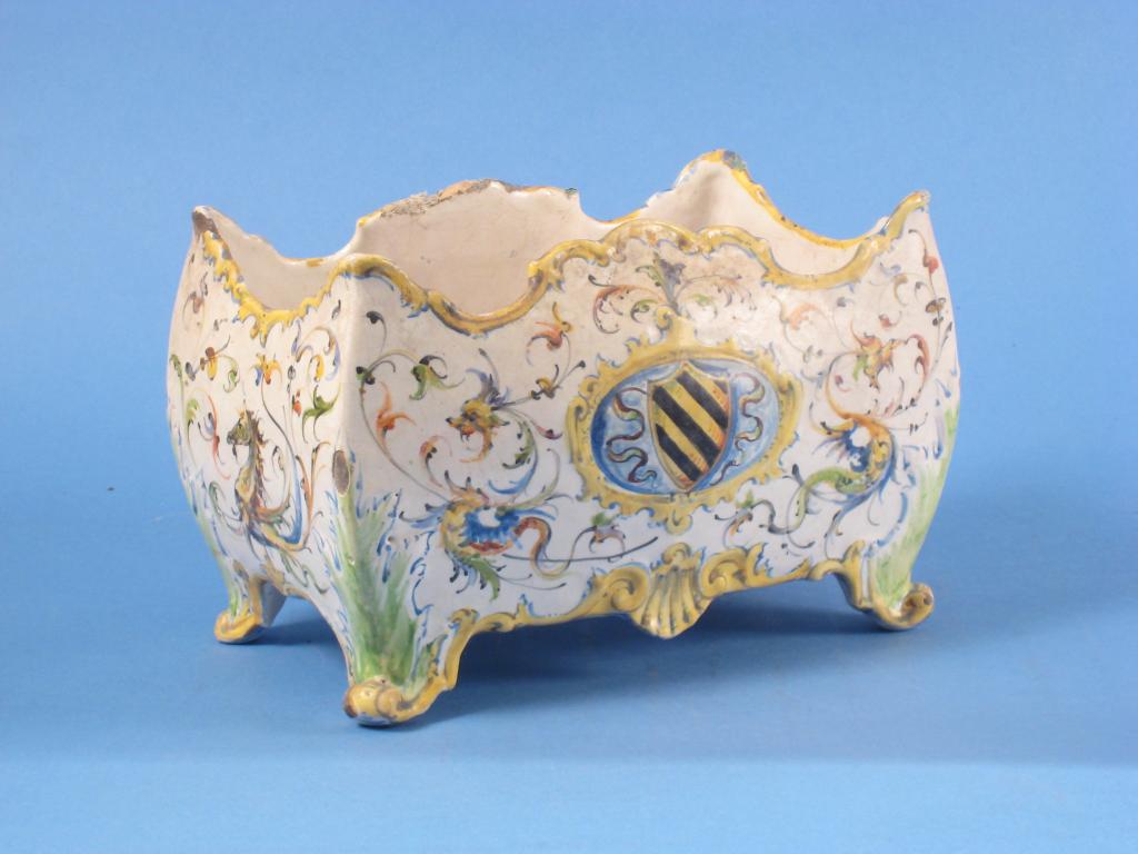 Appraisal: A th Century faience rectangular Jardiniere painted scrolls masks stylised