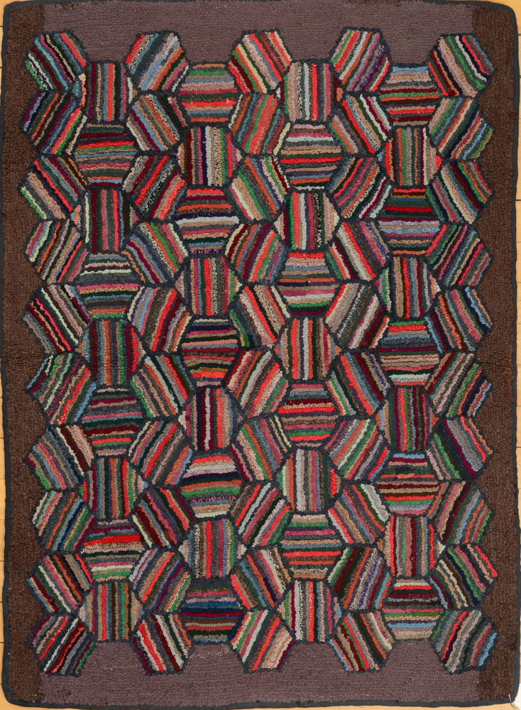 Appraisal: AMERICAN HOOKED RUG Worked with tightly woven stripped hexagons ft