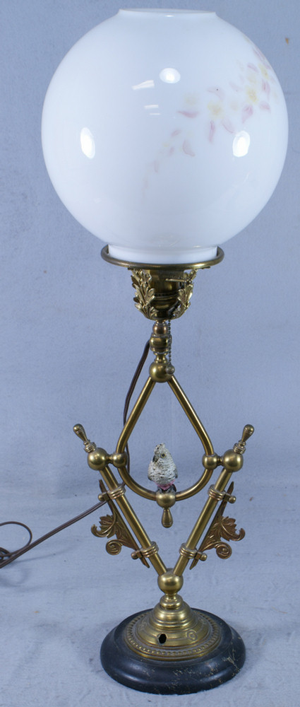 Appraisal: Brass table lamp with painted bird electrified white glass globe