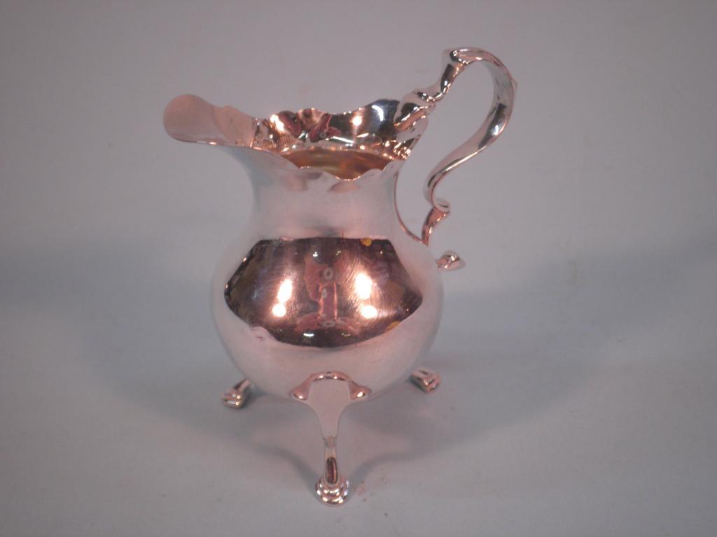 Appraisal: A silver helmet shaped cream jug Birmingham approx oz