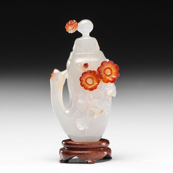 Appraisal: Chinese An agate-handled snuff bottle with relief russet floral motifs