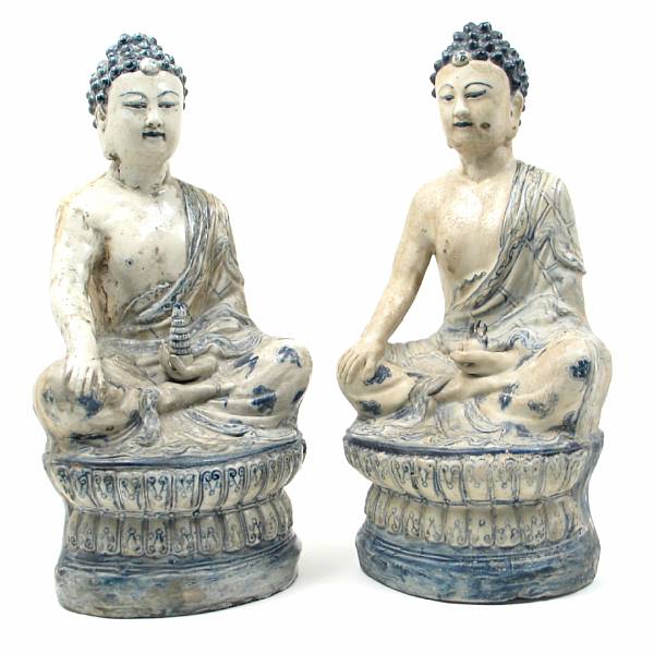 Appraisal: A pair of Chinese black amp white porcelain seated figures