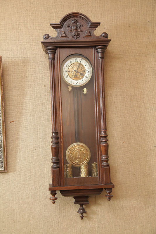 Appraisal: WALL CLOCK Eight day time strike with brass works and