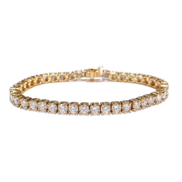 Appraisal: Gold K diamond line tennis bracelet containing prong set round