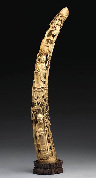 Appraisal: A reticulated ivory tusk with figural decoration th Century The