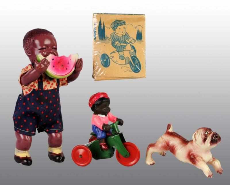 Appraisal: Lot of Tin Celluloid Black Face Toys Description Japanese Pre-war