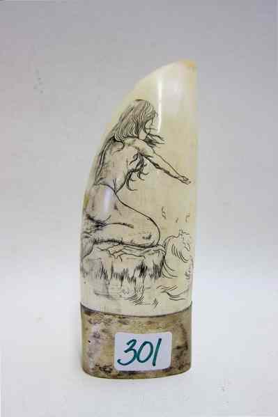 Appraisal: SCRIMSHAWED WHALE TOOTH signed by artist Pam Wilson depicting a