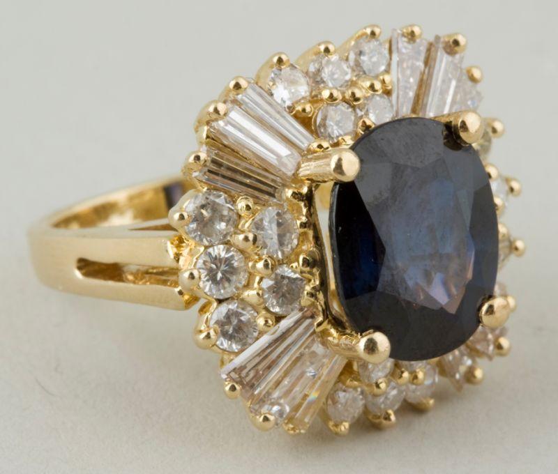 Appraisal: KT Sapphire Diamond Ring with one prong set oval standard