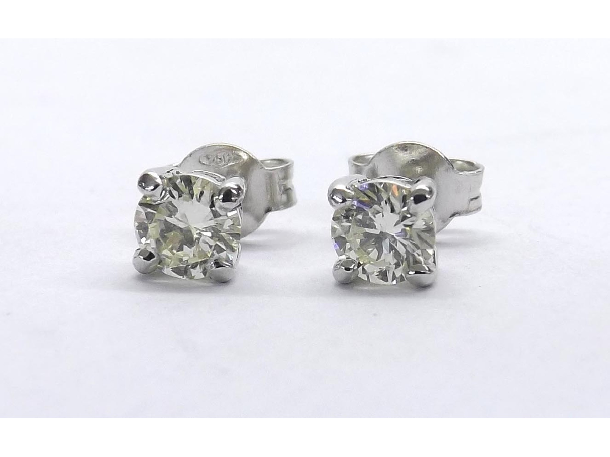 Appraisal: Pair of k white gold diamond ear studs round brilliant-cuts